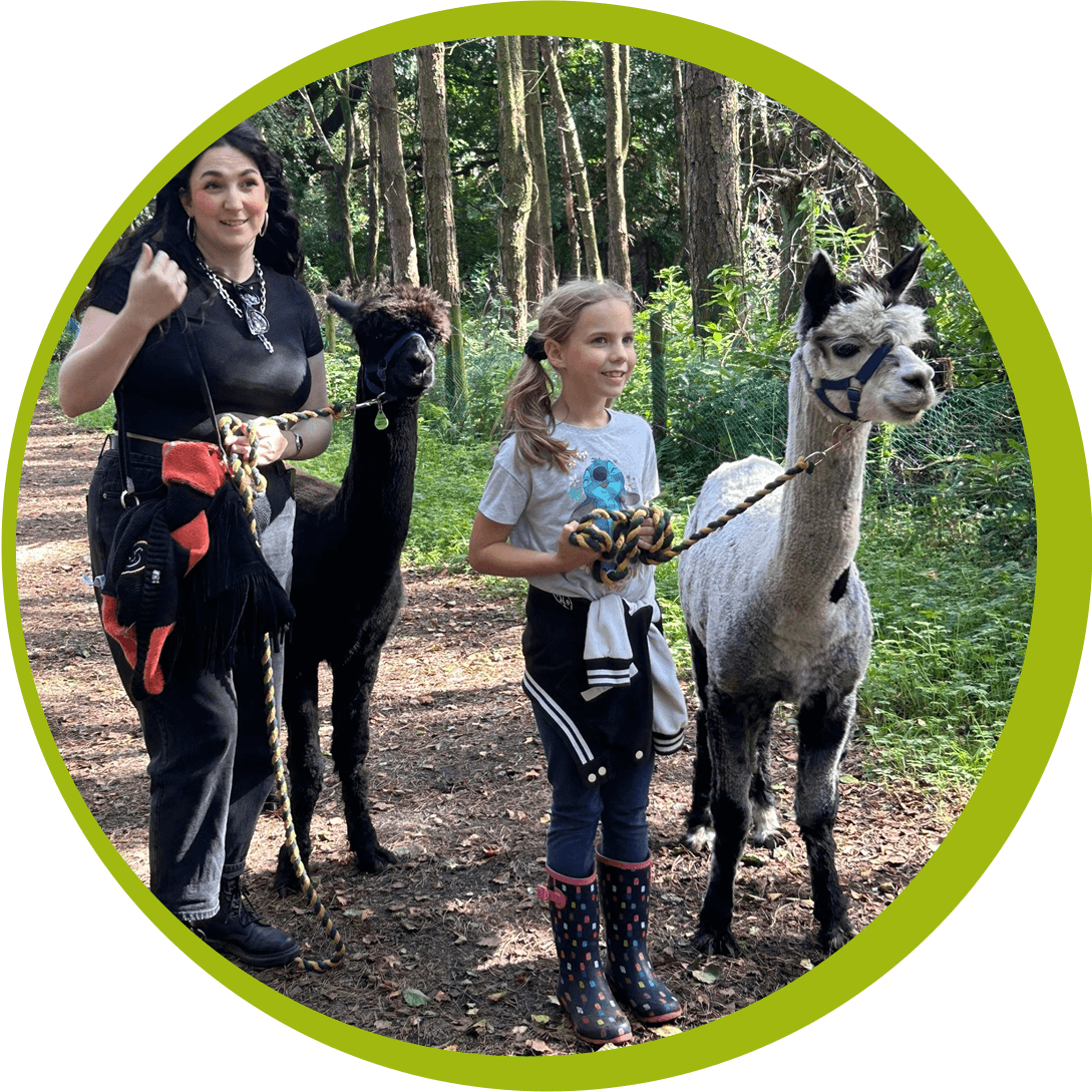 Girl and Mum walking alpacas